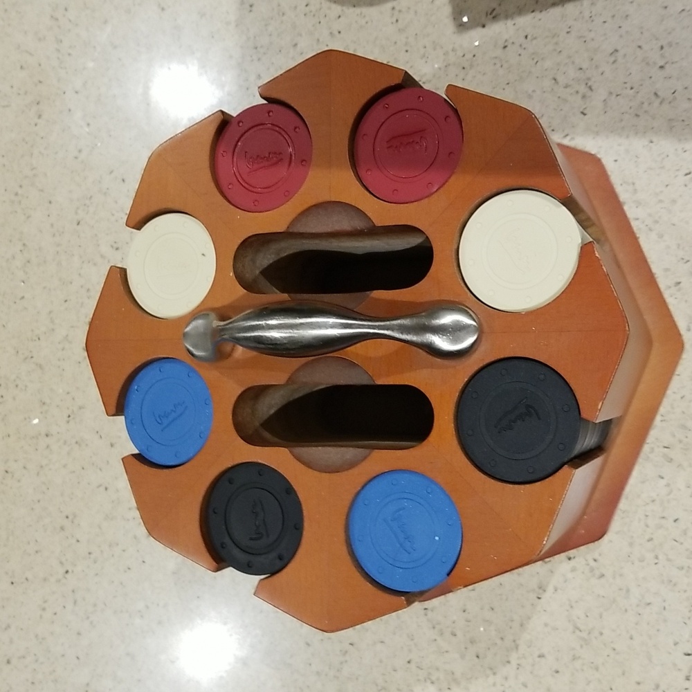 Michael Graves Poker set sans cards.  Beautiful cherry holder w/stainless handle